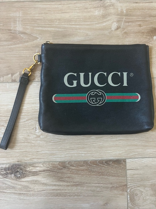 Gucci Handbags - GUCCI Black Pebbled CalfskinLeather Logo Wrist Strap Pouch UNISEX